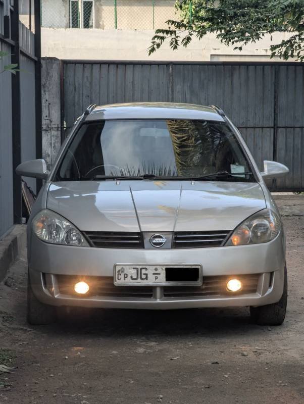 Nissan Wingroad WFY11,